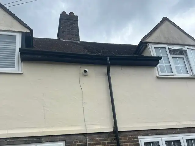 The same gutter and downpipe after the call-out, cleared, reclipped and resealed