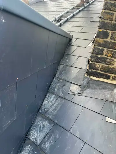 Slate roof meeting a brick wall, finished with new lead work